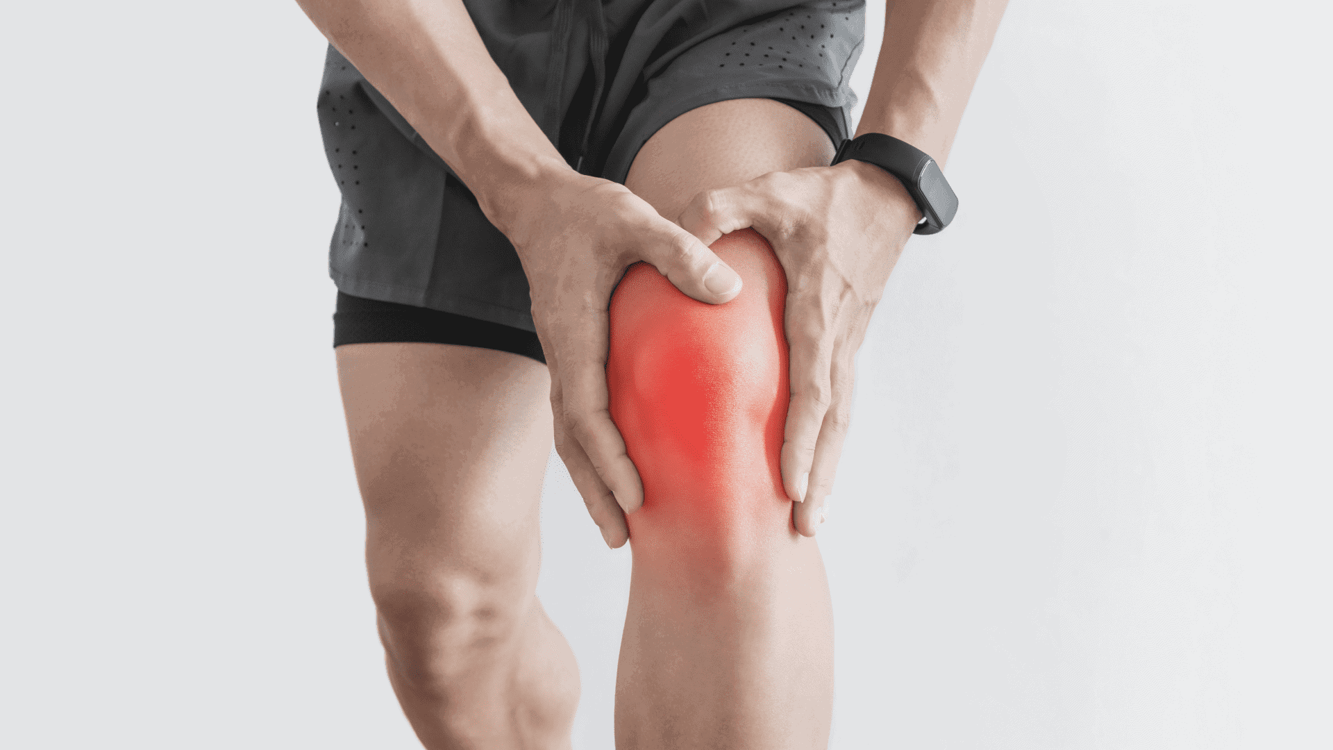 athlete-grips-knee-to-ease-chronic-pain